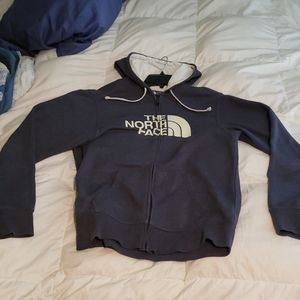 North face blue hoodie with of white accent